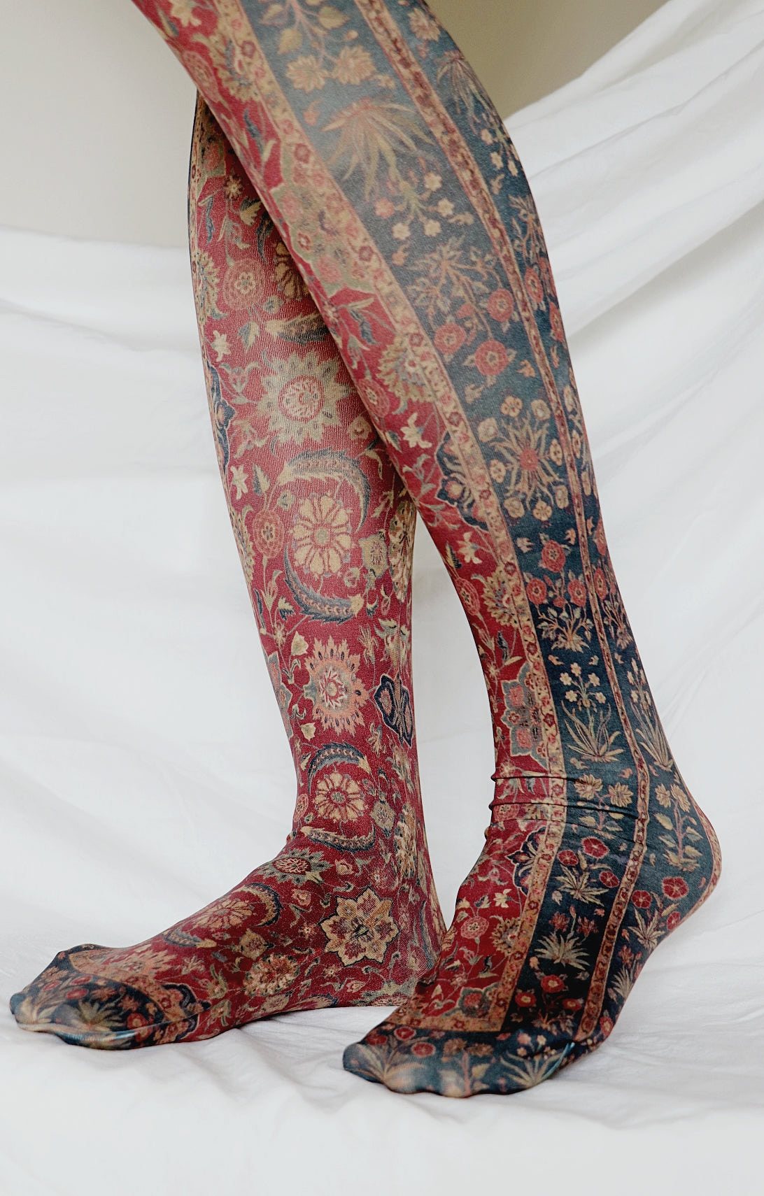 Scrolling vines and blossom art printed on tights.