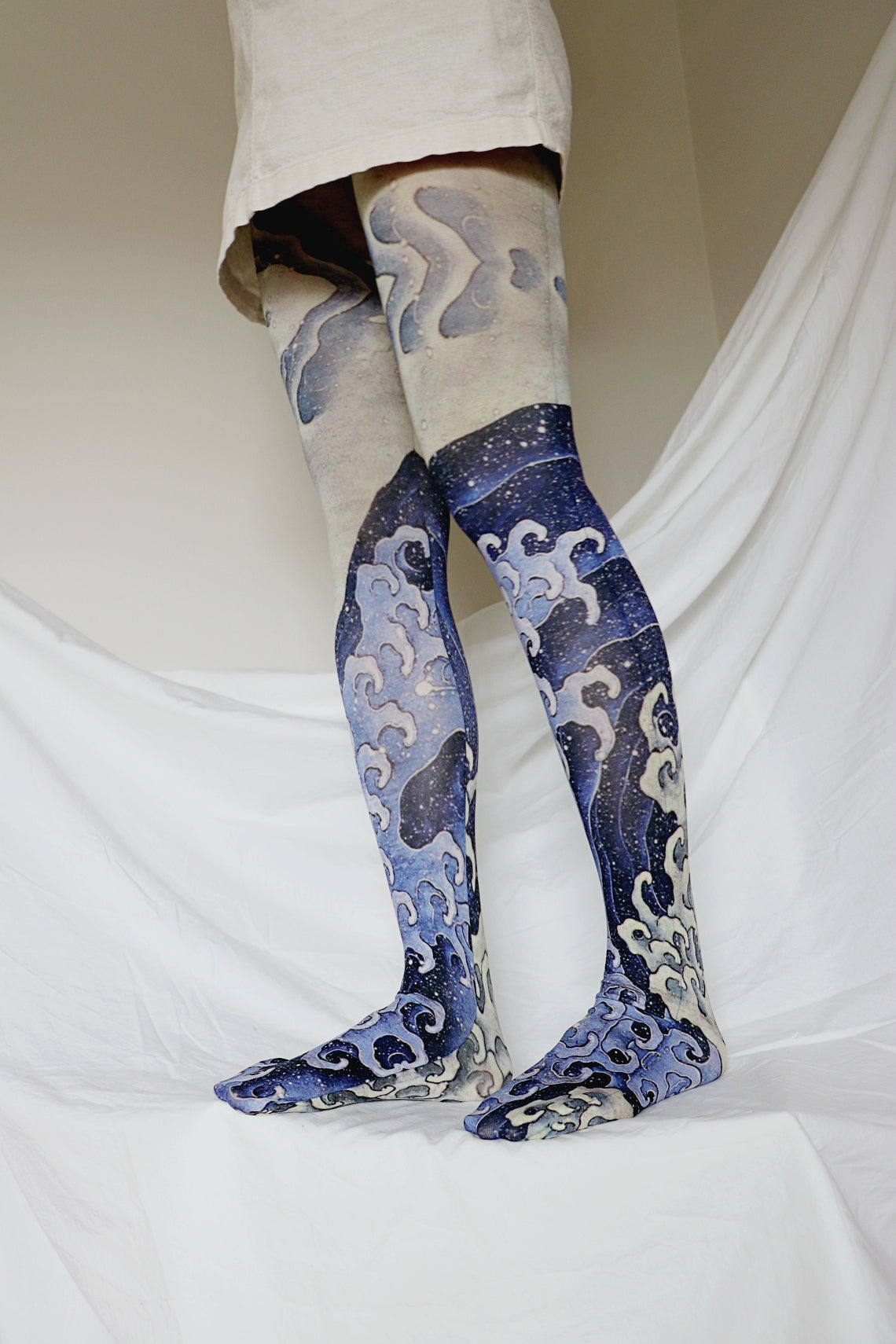 The tights that has a print of wave art work by Hokusai.
