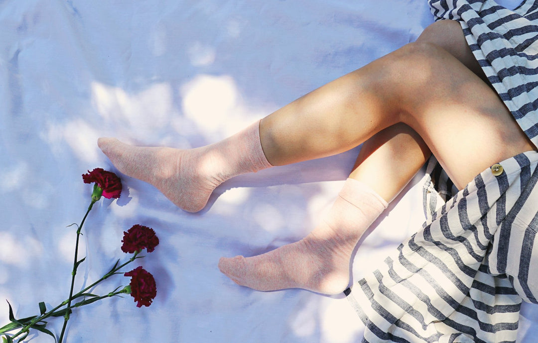 Girls wearing carnation dyed socks with stripe dress.