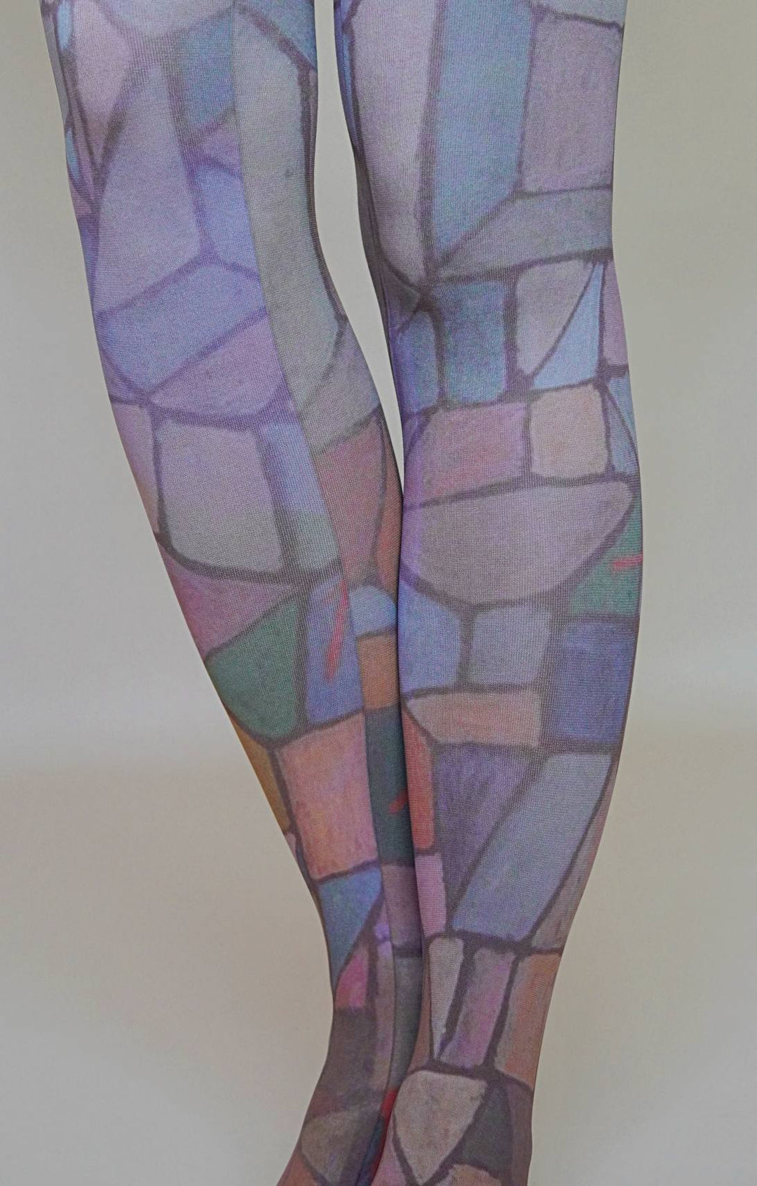 Colorful patterned tights on a plain background