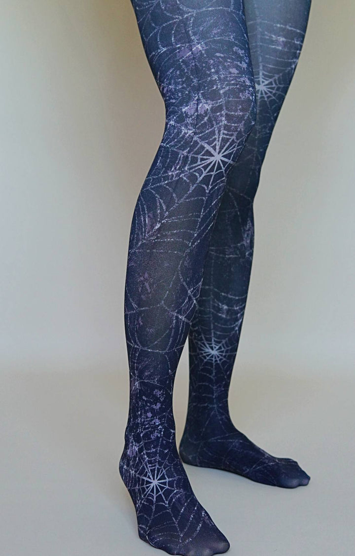 Navy tights with spider web pattern worn by a women.