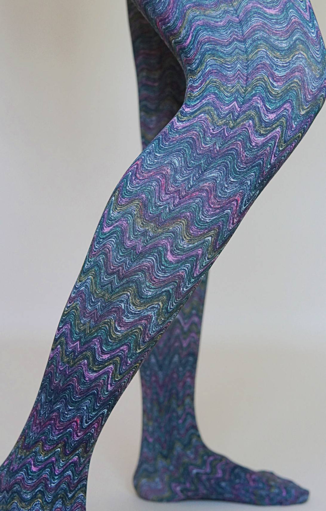 Multicolored wavy patterned tights on a plain background