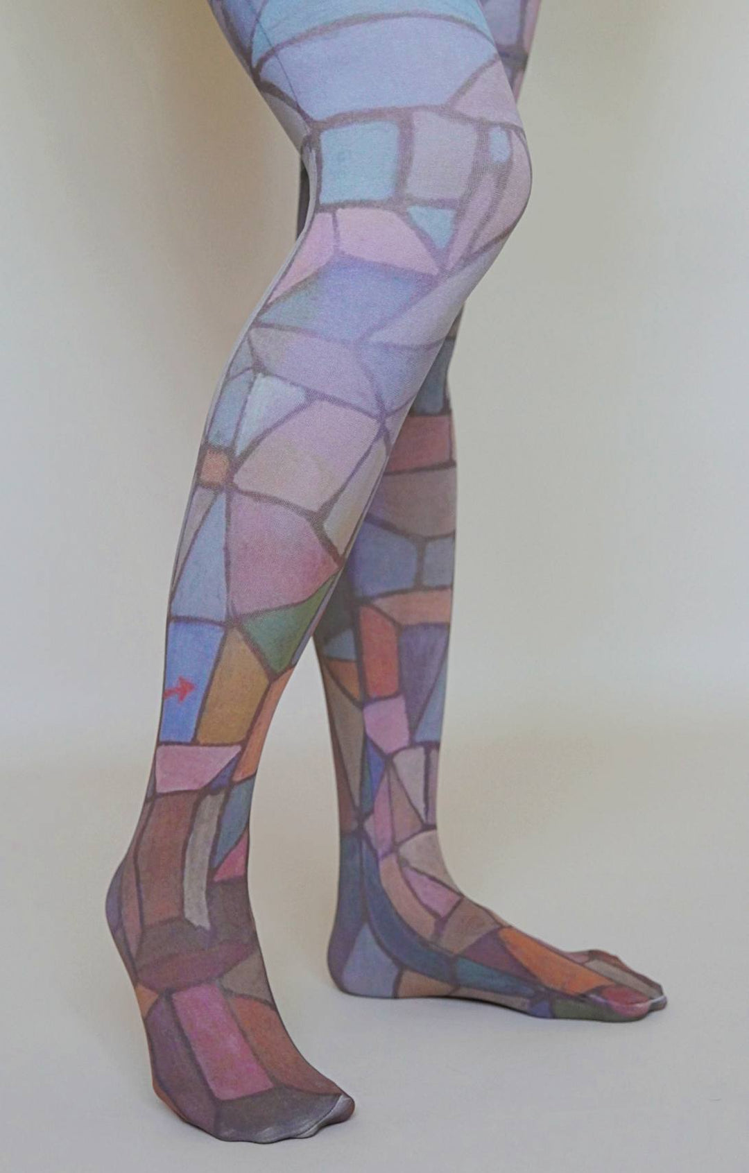 Colorful patterned tights on a plain background
