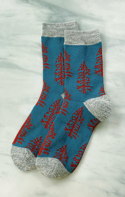 TABBISOCKS brand Replant Pairs Tree Socks in Teal color with Grey color at the cuff and toe and reddish brown tree design all over the socks.