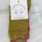 Pear color of TABBISOCKS brand Ruffle Line Crew Socks with pink point color.