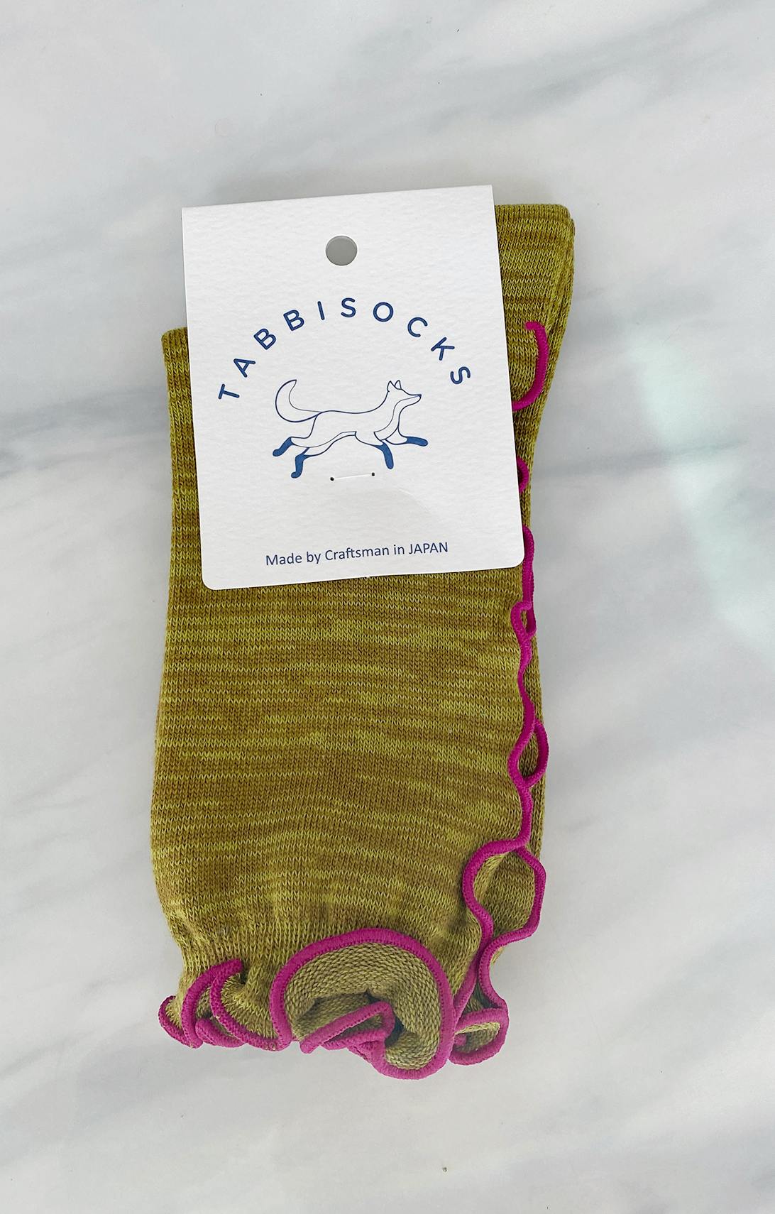 Pear color of TABBISOCKS brand Ruffle Line Crew Socks with pink point color.
