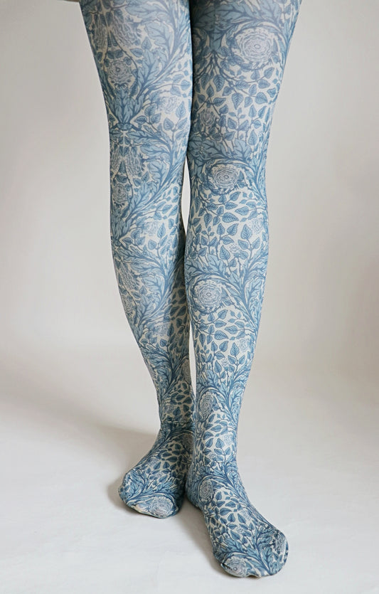 Overall light blue-ish fabric with rose floral pattern throughout the tights.