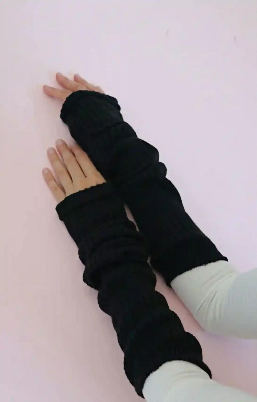 Woman's arm wearing ivory colored TOPS with black color of TABBISOCKS brand Wool Blend Leg and Arm Warmers