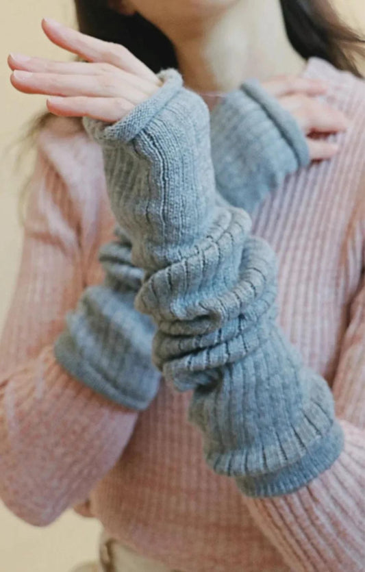 Arm of a woman wearing an ivory-colored sweater wearing the Grey color of a product called Wool Blend Leg and Arm Warmers of the TABBISOCKS brand