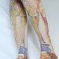 Woman wearing TABBISOCKS brand Alfons Maria Mucha Printed Tights from front
