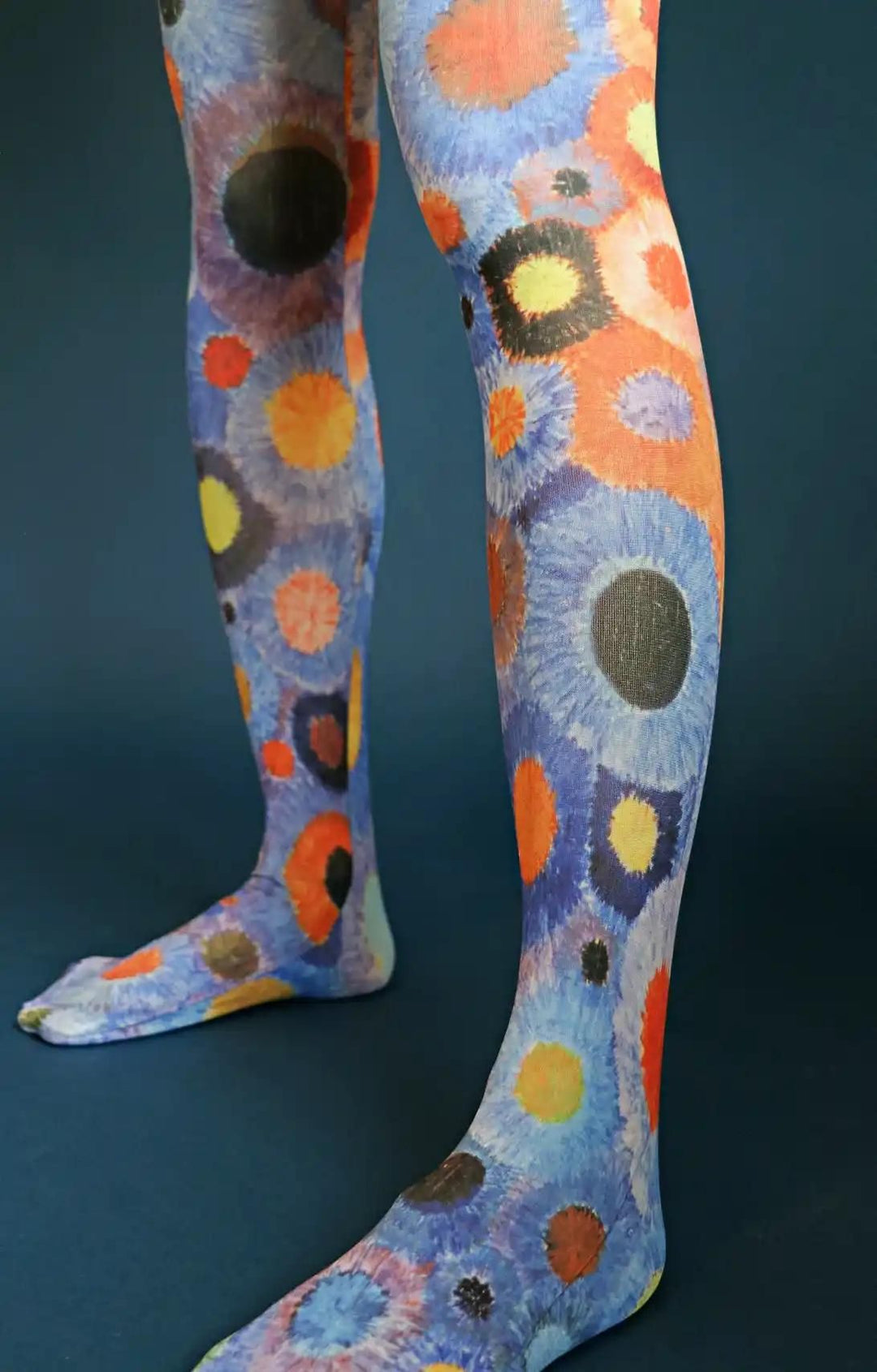 Woman's leg wearing a fabric entirely red in a product called BOUQUET BEAUTY-ORRANGE from the TABBISOCKS brand Floral Printed Tights Collection