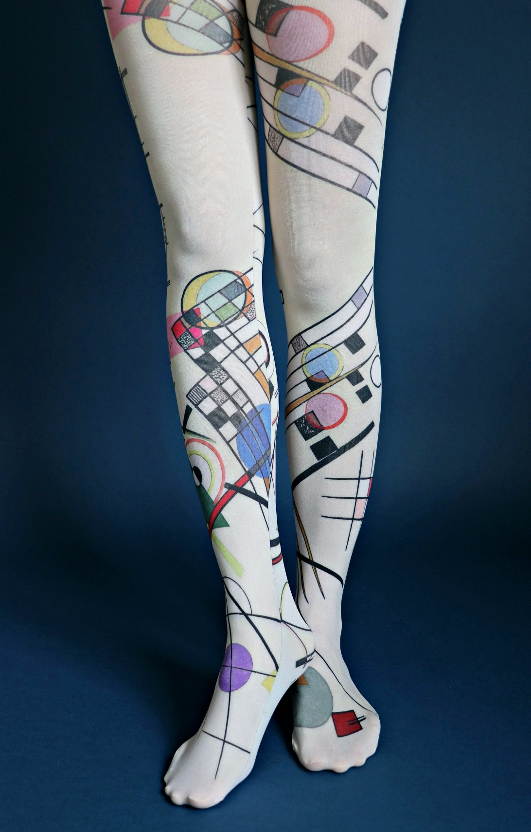 Composition from the Wassily Kandinsky Collection of the TABBISOCKS brand, with black and pink geometric patterns, musical notes and sheet music, and the overall color is a dull light green
