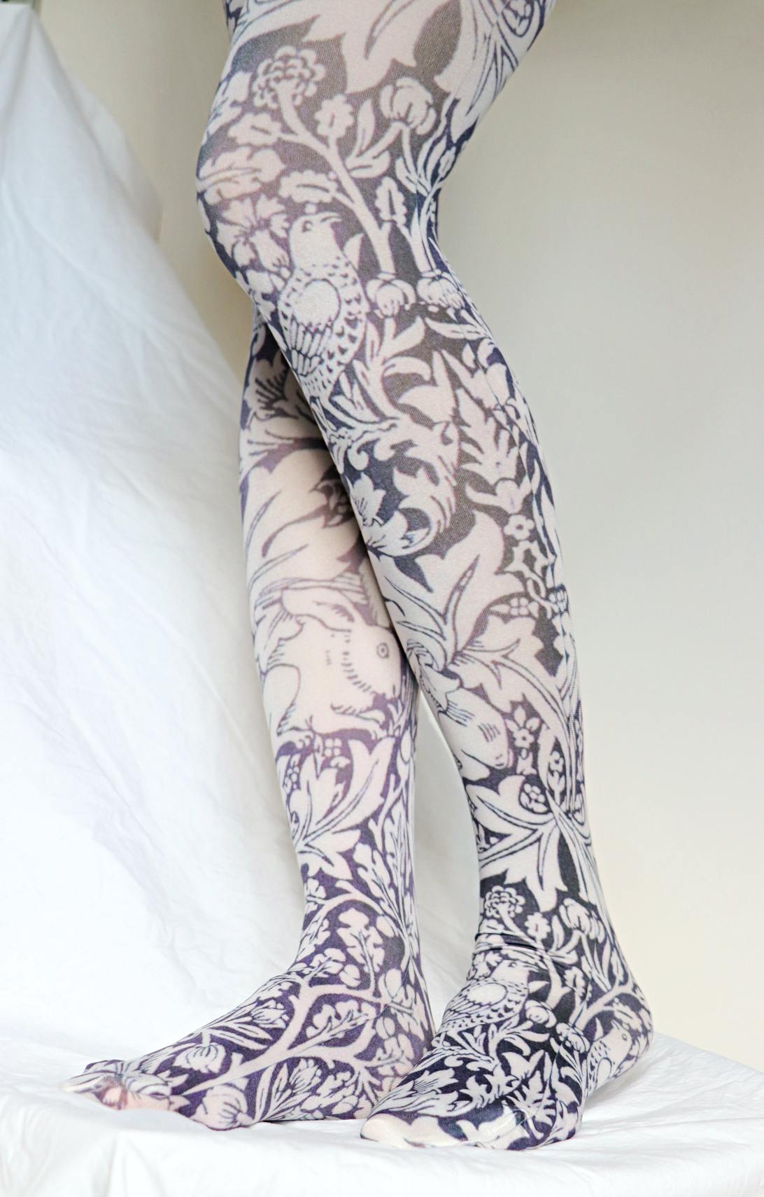 TABBISOCKS brand William Morris collection Bre'r Brother Rabbit tights with an overall rabbit and plant design in antique white and black