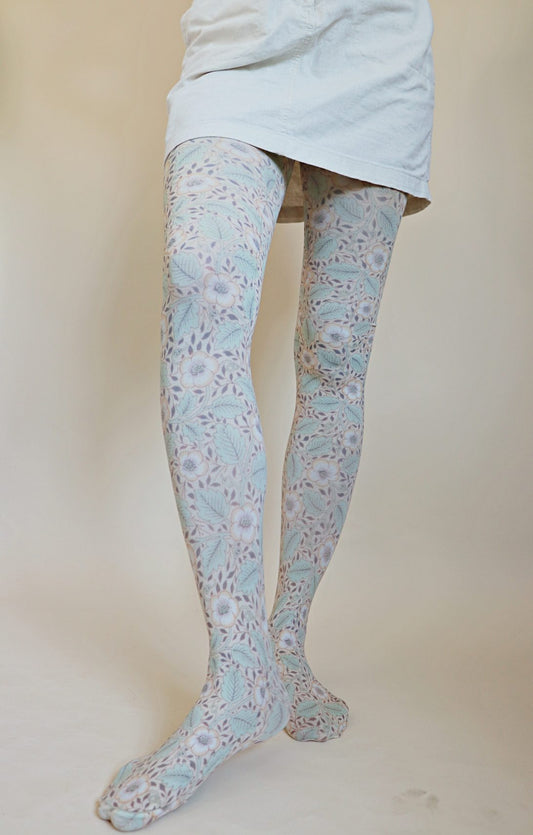 TABBISOCKS brand William Morris collection tights called Christchurch, with an overall floral design, antique green in color