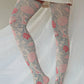 Cray tights from the William Morris collection of the TABBISOCKS brand, with an overall design of red and pink flowers, in an antique-ish Grey color