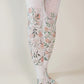 TABBISOCKS brand William Morris collection tights called Jasmine, with an overall design of jasmine flowers, in antique white, pink and green colors