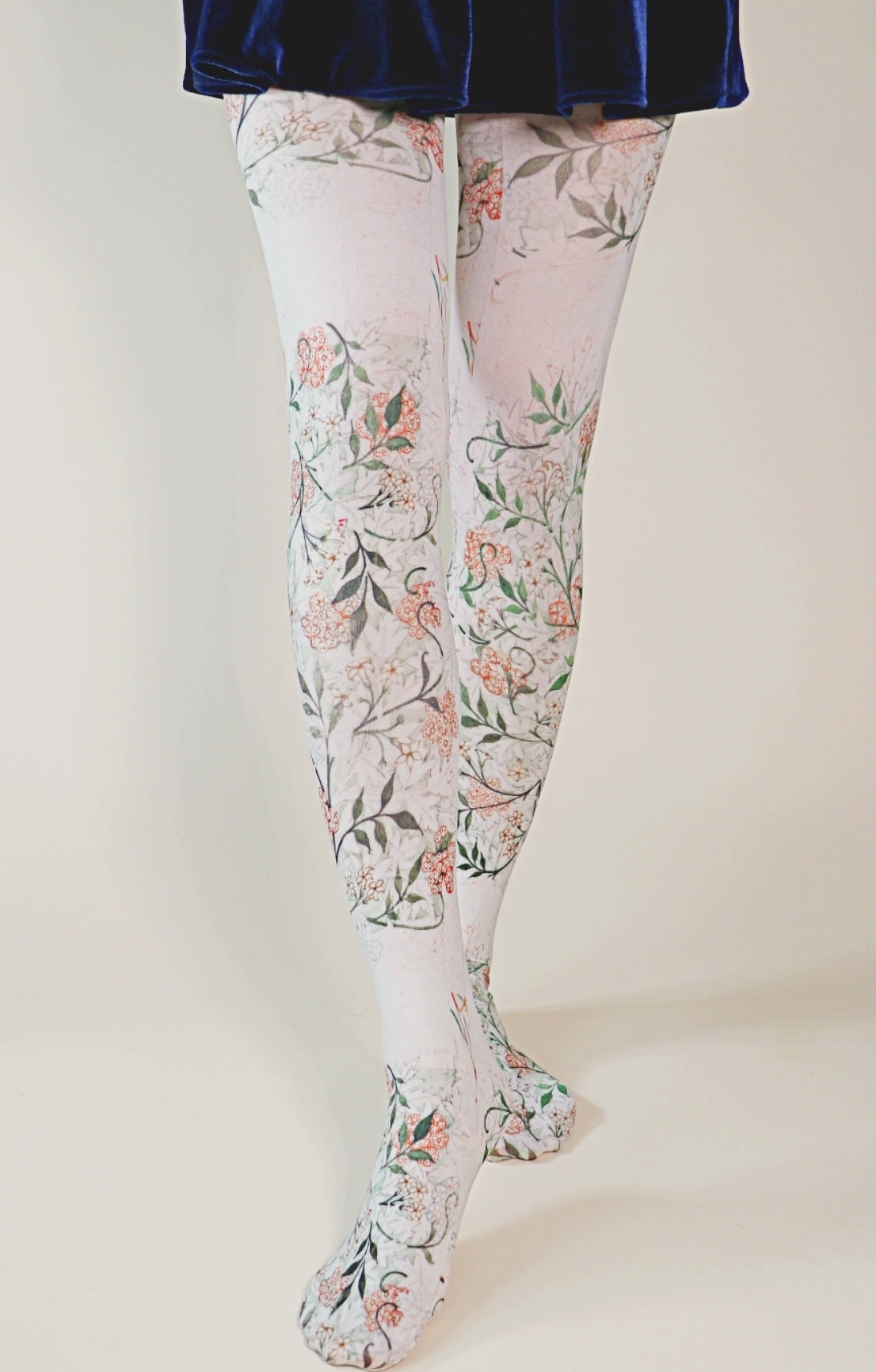 TABBISOCKS brand William Morris collection tights called Jasmine, with an overall design of jasmine flowers, in antique white, pink and green colors