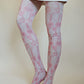 Tights called Kennet from the William Morris collection of the TABBISOCKS brand, with a pink floral design throughout, in an antique-like peach color