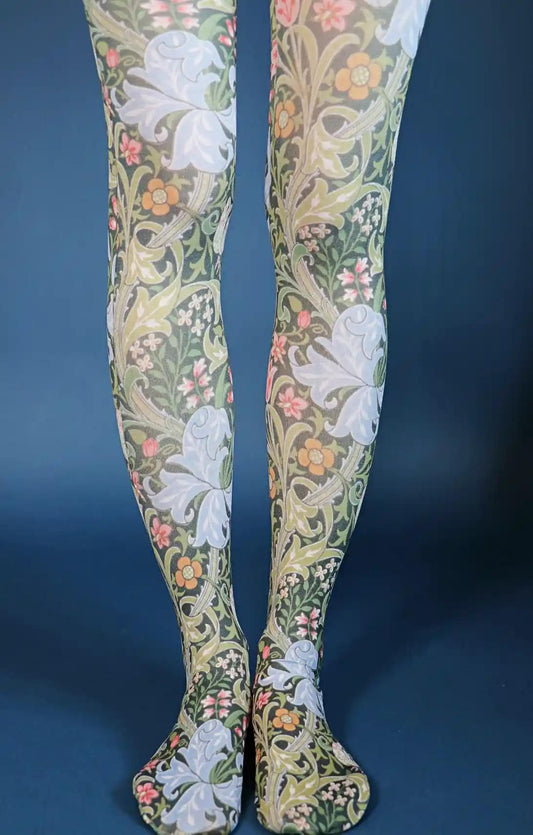 Purple Golden Lily from the William Morris collection of the TABBISOCKS brand, with large light purple Lily flowers and a pattern of pink, white and orange small flowers, and the overall color is dark green, the color of the leaves and the Lily flowers