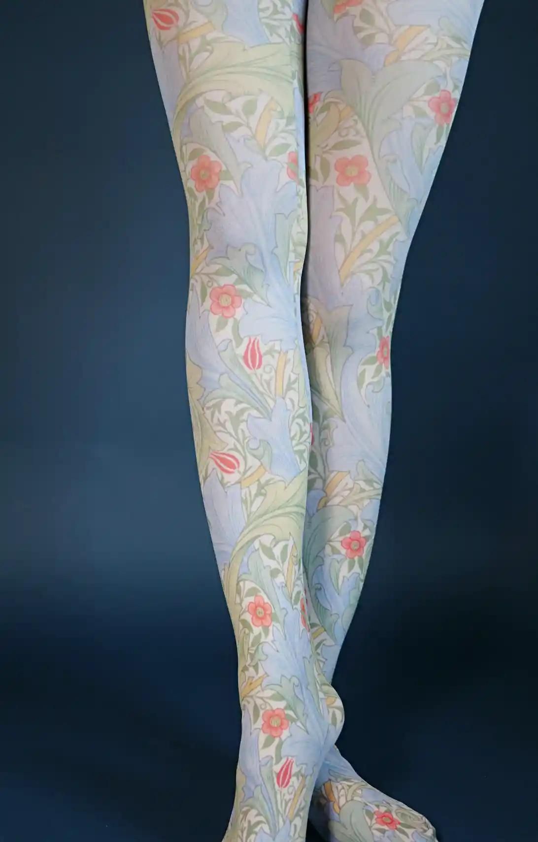 Sky Blue Glanville from the William Morris collection of the TABBISOCKS brand, with a pink-orange floral and light green leaf pattern, and light blue overall color