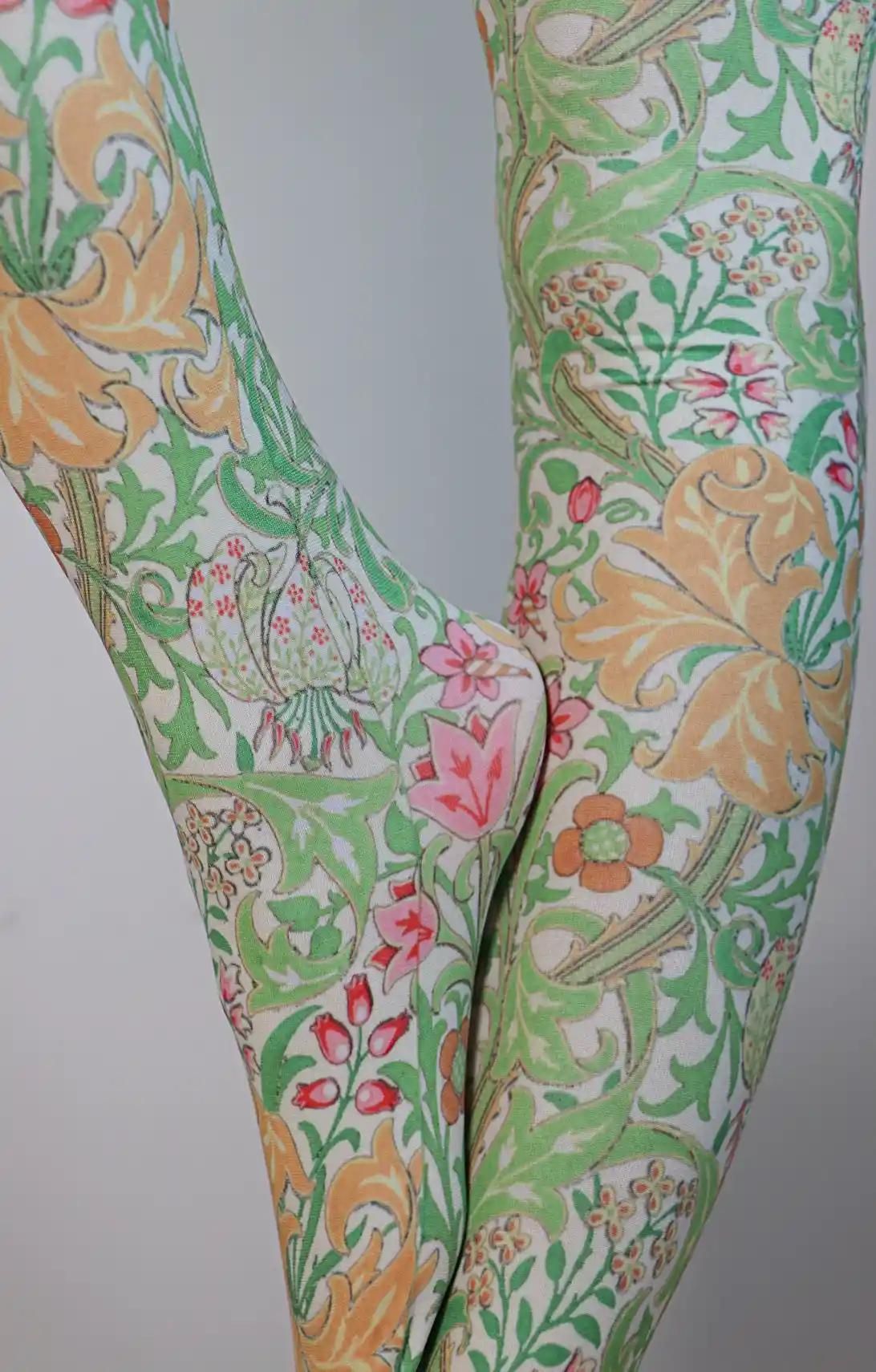 Yellow Golden Lily from the William Morris collection of the TABBISOCKS brand, with a pattern of pinks, reds, flowers and orange flowers with strong yellow, and the overall color is green, the color of the leaves